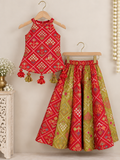 Vibrant Red and green silk two-piece set featuring a printed halter top with playful tassels and a flowy palazzo