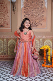 Stunning rust orange 4-piece tissue silk lehenga set with embellished crop top, net dupatta and matching potli bag