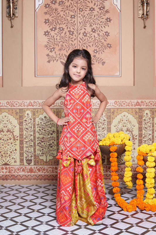 Vibrant Red and green silk two-piece set featuring a printed halter top with playful tassels and a flowy palazzo