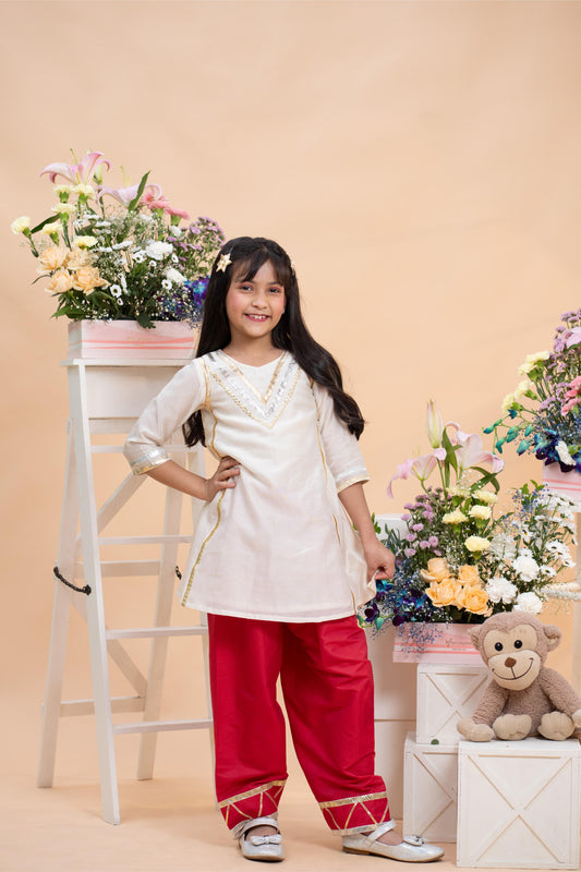 ivory kurti with red farsi salwar set for girls by Kirti Agarwal