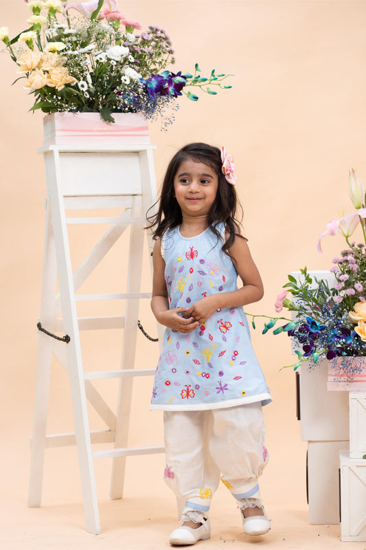 sky blue embroidered kurti with white dhoti pants set for girls by Kirti Agarwal