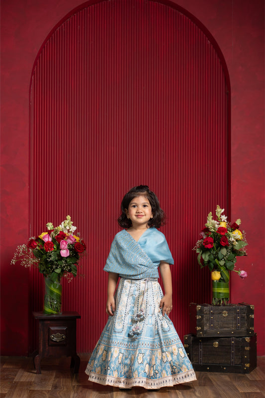 powder blue draped blouse printed lehenga set for girls by Kirti Agarwal