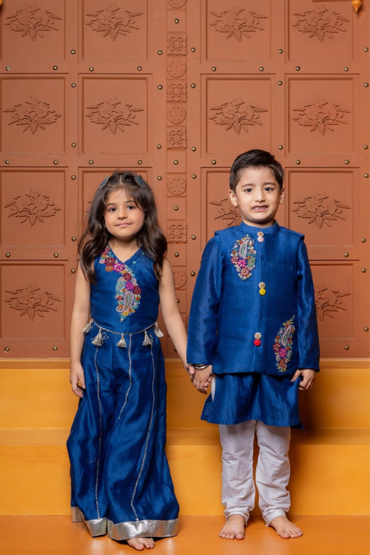 Blue Floral Embroidered Sleeveless Top With Palazzo & Pin Tuck Detailed Kurta With Embroidered Jacket And Pyjama - Kirti Agarwal