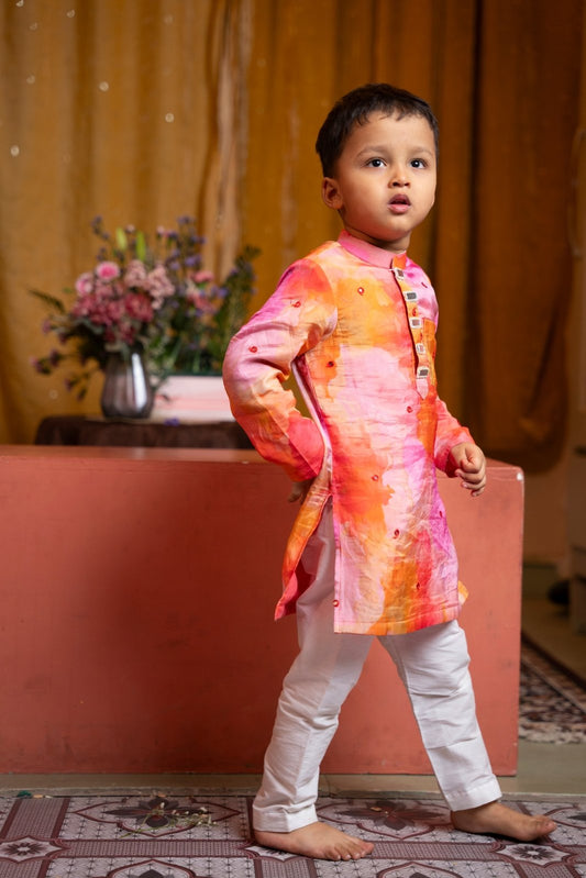 Brighten up festivities with this vibrant sibling twinning set in cheerful watercolor tones and playful embroidery. - Kirti Agarwal