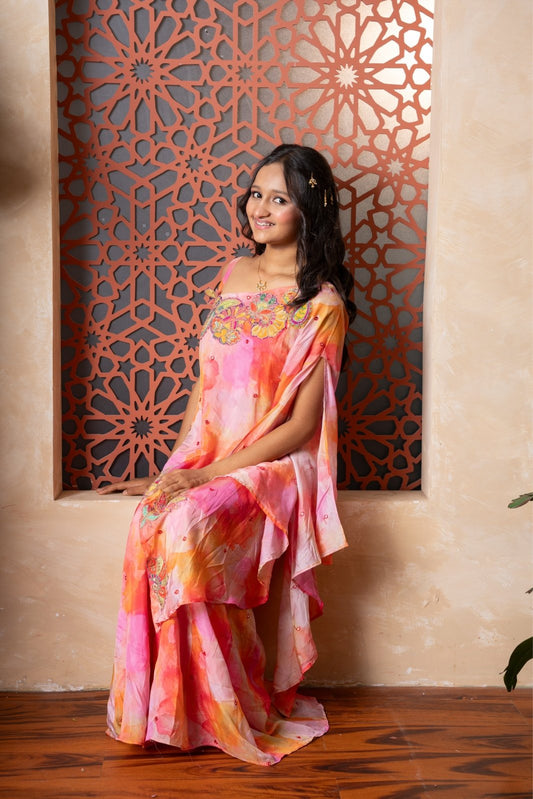 Brighten up festivities with this vibrant sibling twinning set in cheerful watercolor tones and playful embroidery. - Kirti Agarwal