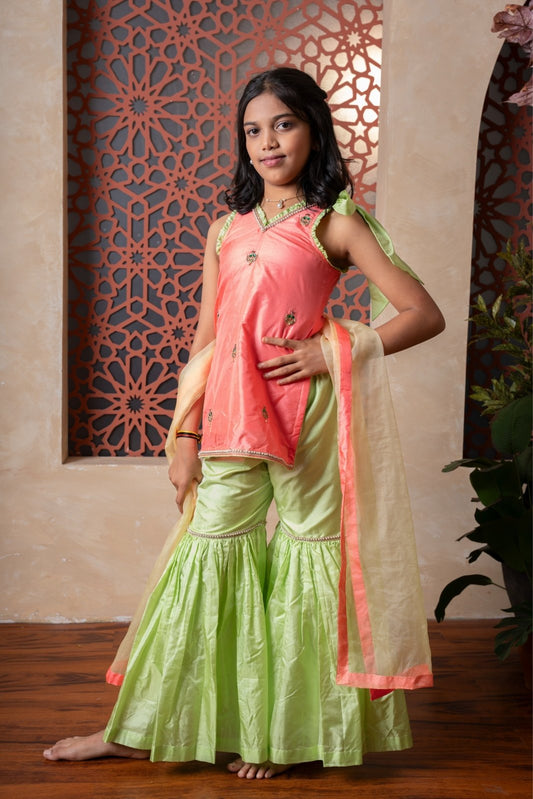 Charming orange and green sharara set with delicate embroidery and contrast dupatta — a joyful festive outfit for your little one. - Kirti Agarwal