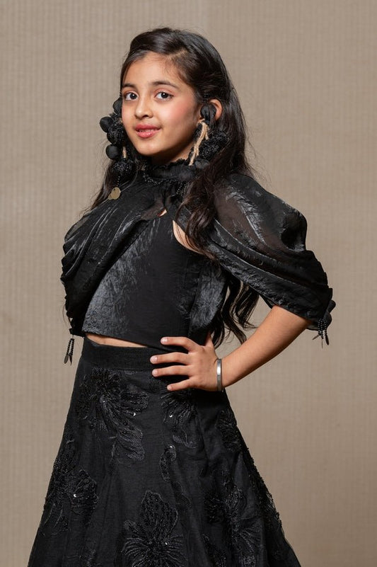 Elegant black gown with intricate floral embroidery and a voluminous Lahenga, perfect for making a timeless statement at any formal event. - Kirti Agarwal