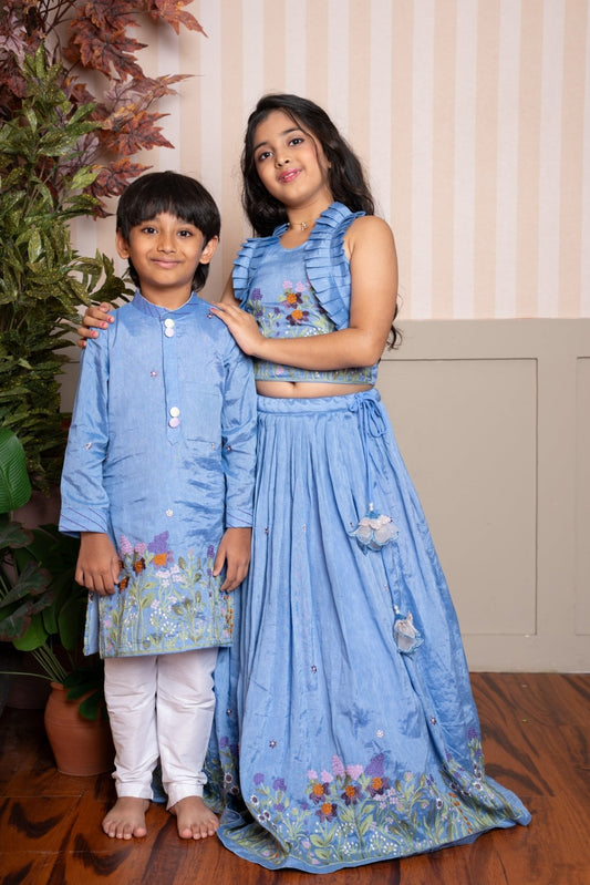 Powder blue embroidered lehenga set with ruffle crop top & Sky blue floral embroidered kurta set - Kirti Agarwal