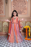 Stunning rust orange 4-piece tissue silk lehenga set with embellished crop top, net dupatta and matching potli bag