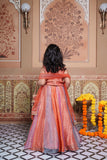 Stunning rust orange 4-piece tissue silk lehenga set with embellished crop top, net dupatta and matching potli bag