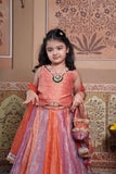 Stunning rust orange 4-piece tissue silk lehenga set with embellished crop top, net dupatta and matching potli bag