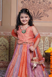 Stunning rust orange 4-piece tissue silk lehenga set with embellished crop top, net dupatta and matching potli bag