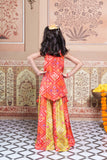 Vibrant Red and green silk two-piece set featuring a printed halter top with playful tassels and a flowy palazzo