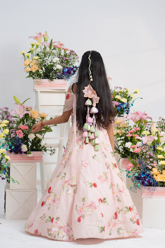 Designer blush pink girls lehenga outfit with statement back latkan