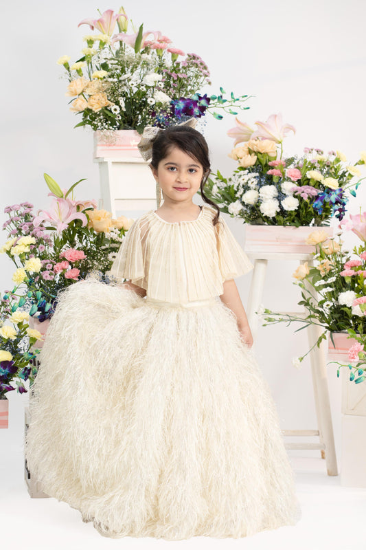 Ivory pleated shimmer top with dramatic feather skirt for girls