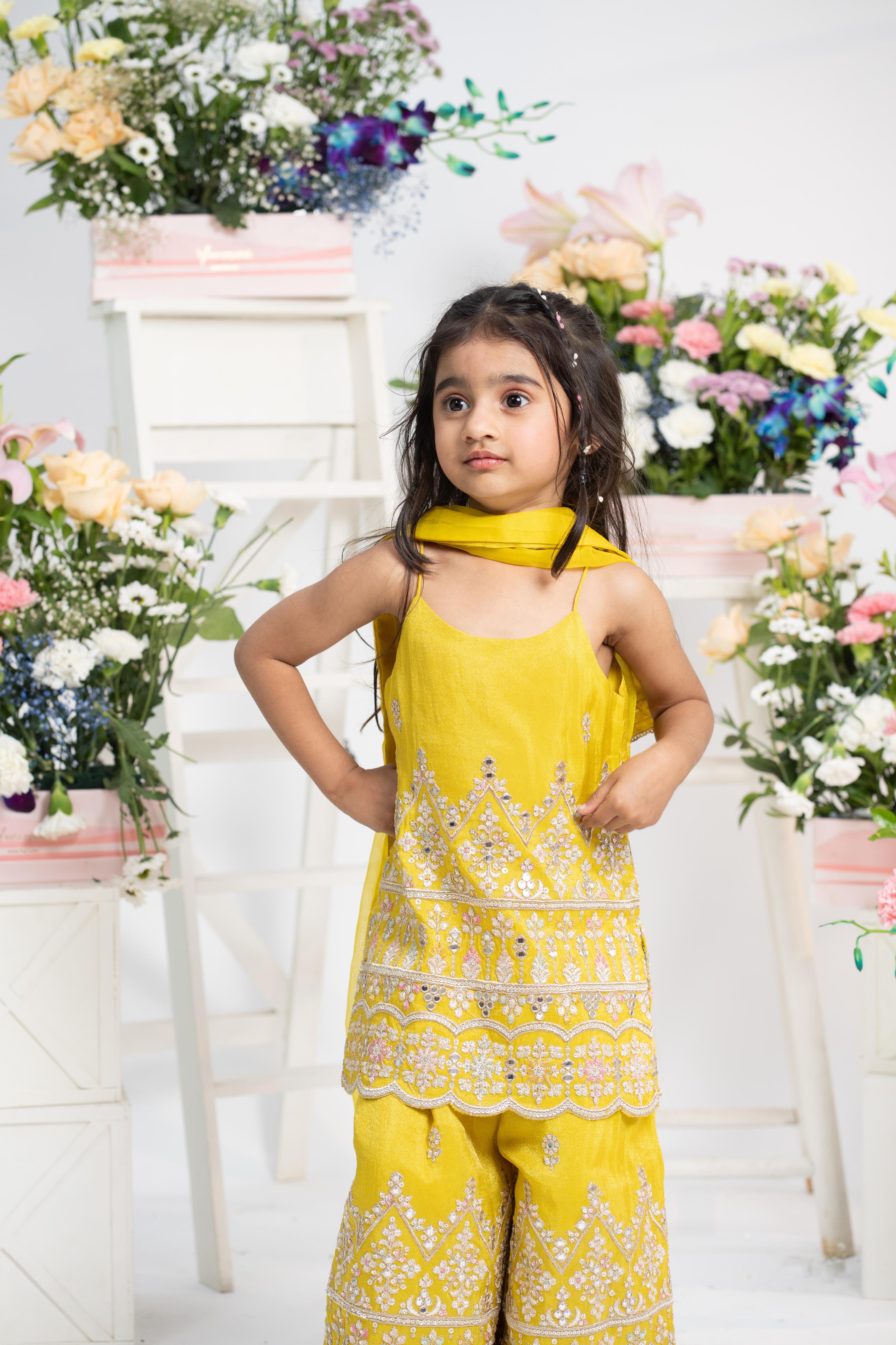Kids festive yellow sharara set with dupatta by Kirti Agarwal