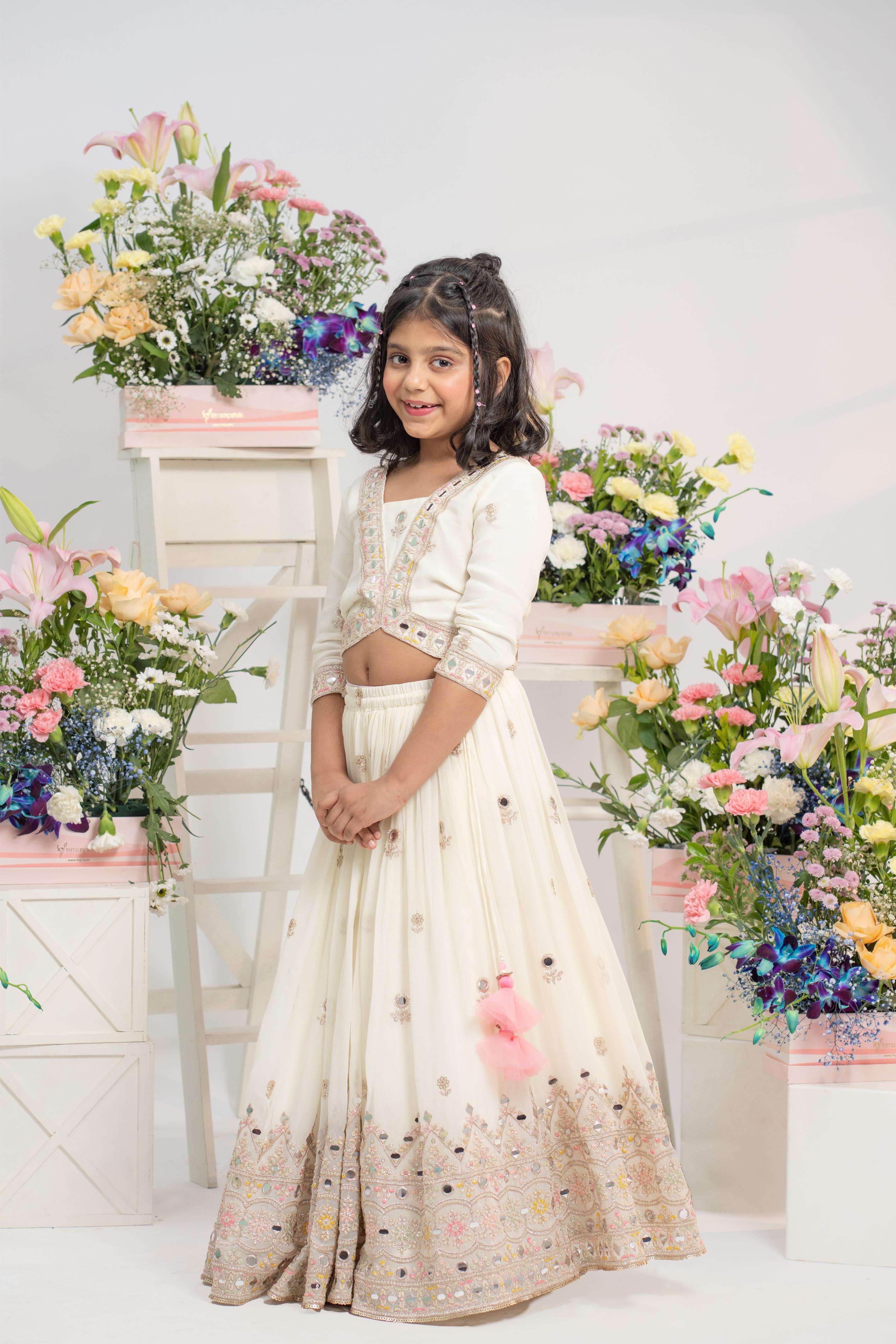 Ivory embroidered lehenga set for girls with mirror work blouse