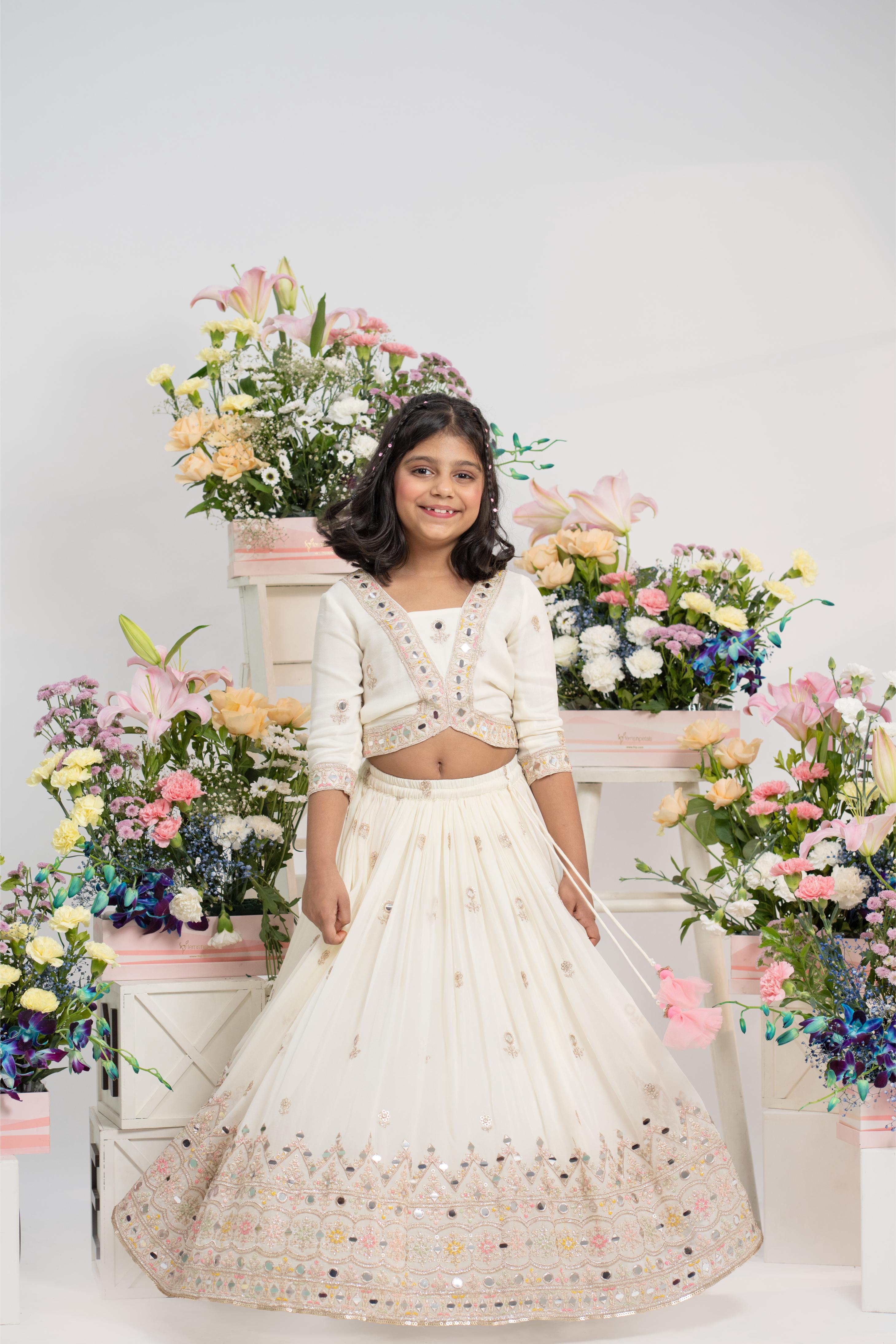 Designer girls ivory lehenga with multicolor embroidered border