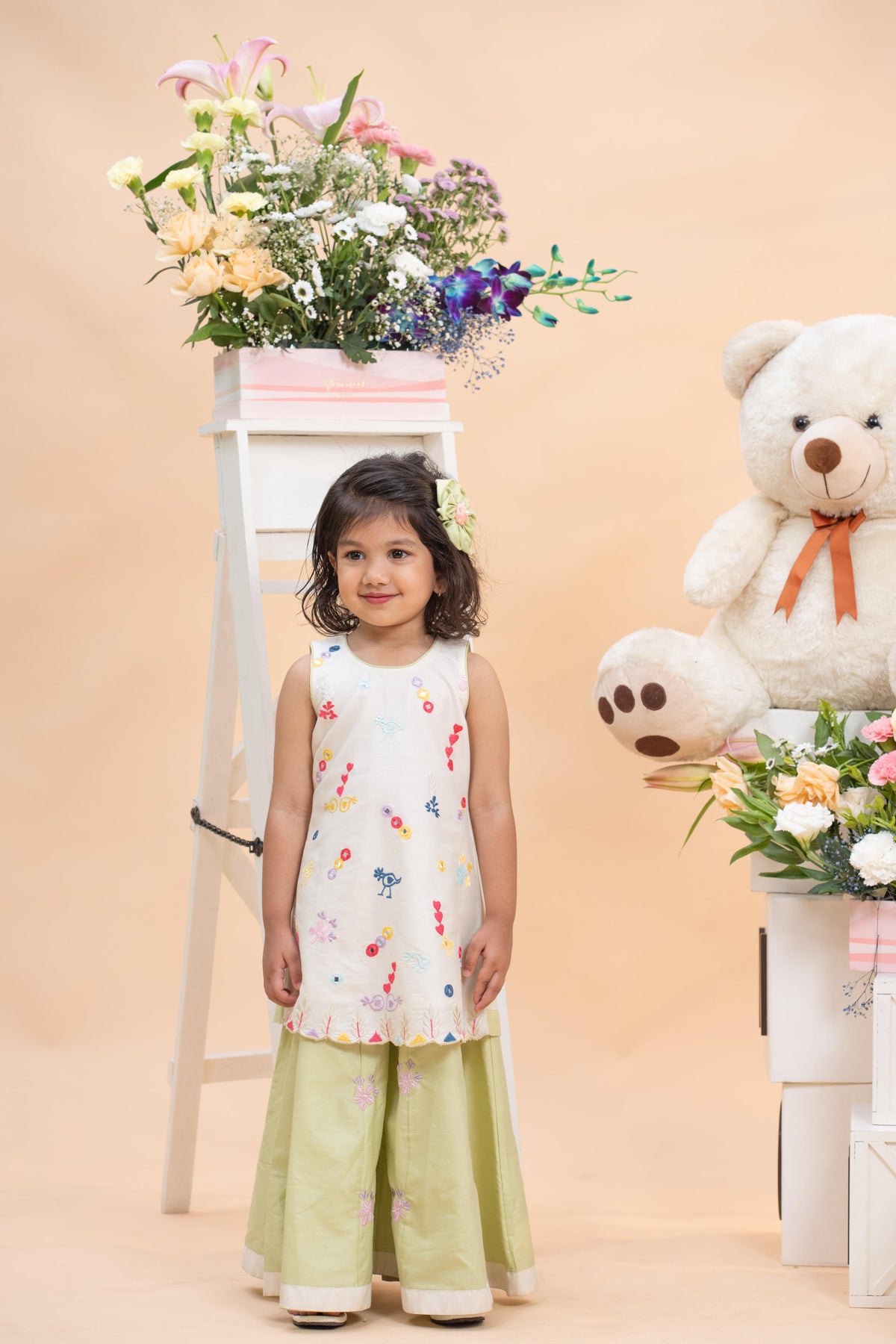 ivory embroidered kurti with pistachio flared sharara set for girls by Kirti Agarwal