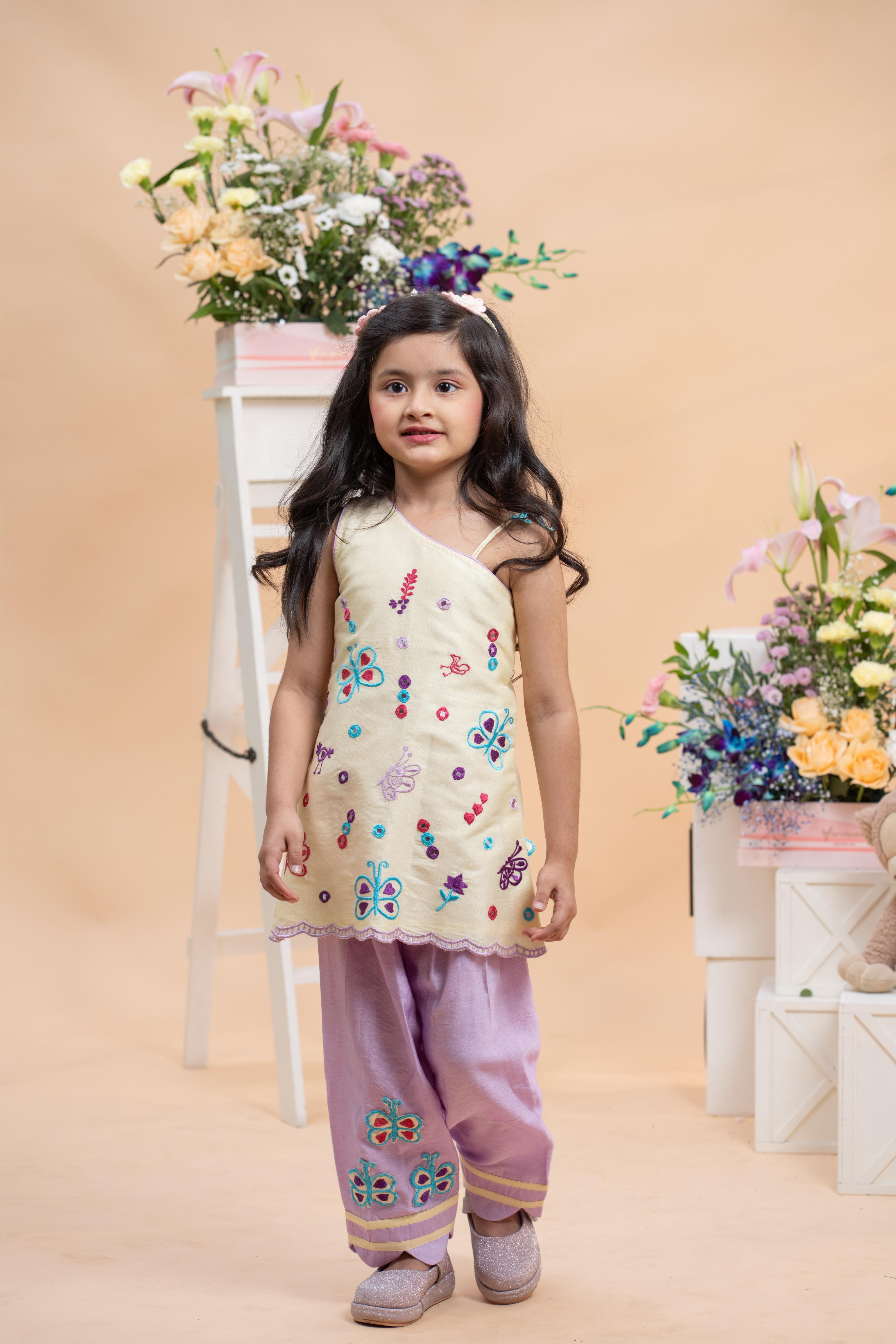 pastel yellow one shoulder kurti with lavender salwar set for girls by Kirti Agarwal