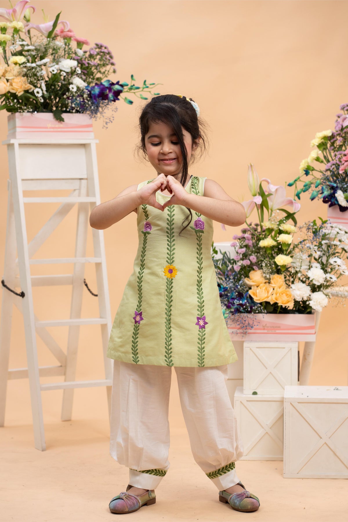 pistachio embroidered sleeveless kurti with white comfort pants set for girls by Kirti Agarwal