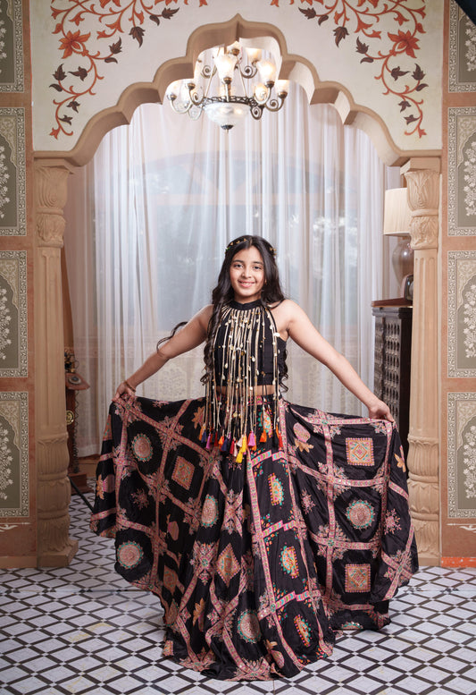 Black Embroidered Crepe Lehenga Set with Statement Pearl Tassel Top.
