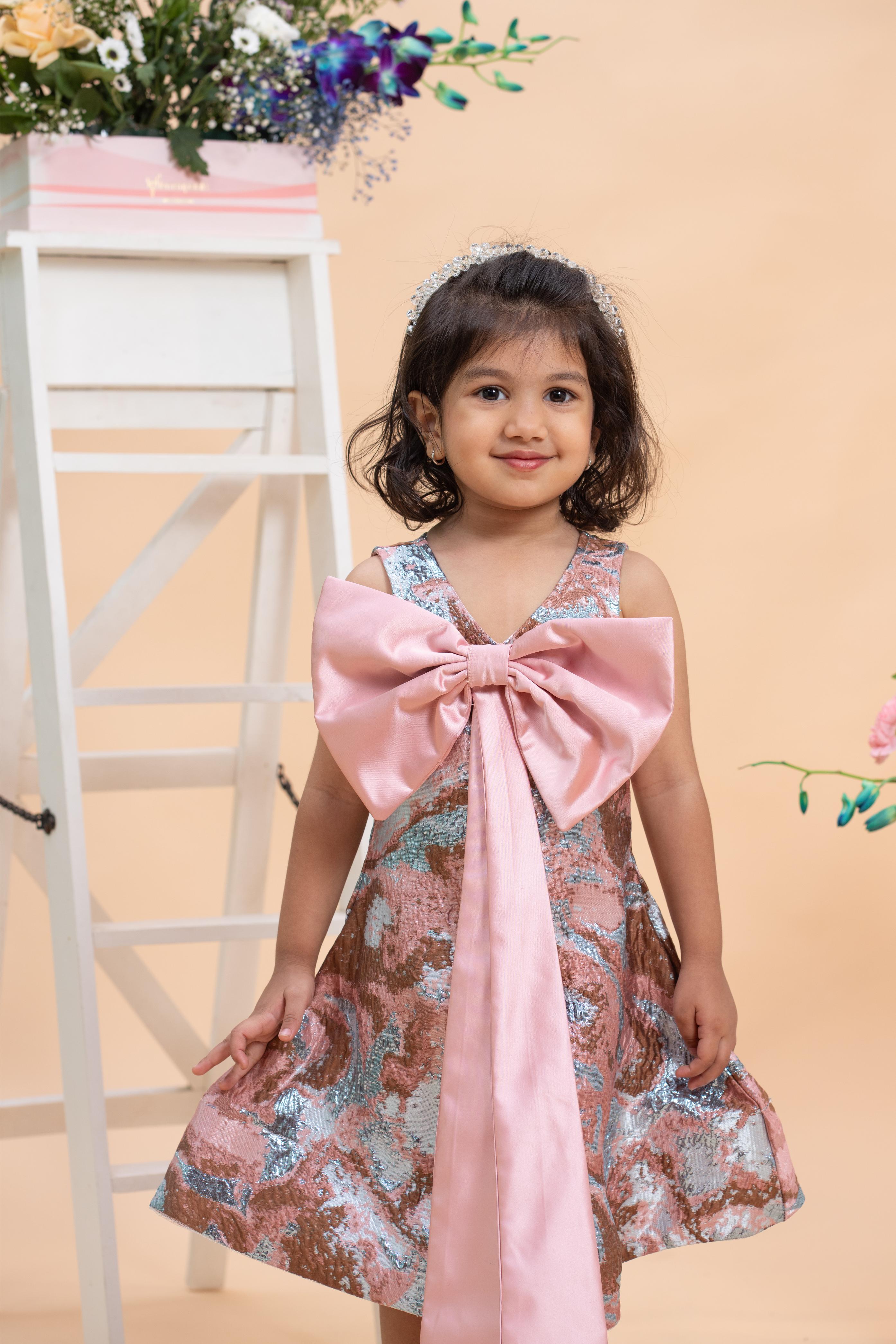 designer blush pink girls party dress with bow detail