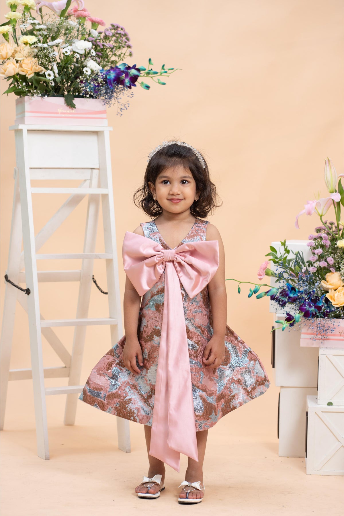 blush jacquard party dress for girls with satin bow by Kirti Agarwal