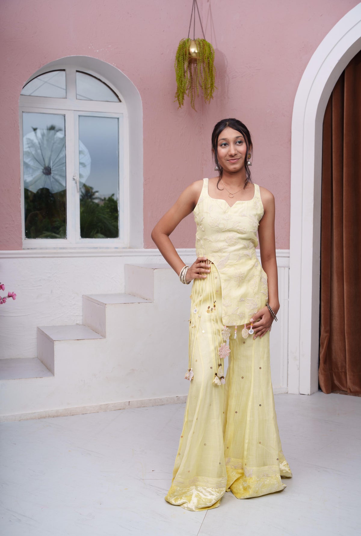 Pastel Yellow Floral Embroidered Asymmetric Top With Flared Palazzo & Tassel Detailing