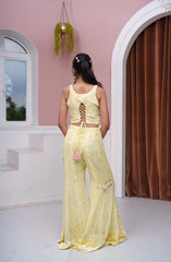 Pastel Yellow Floral Embroidered Asymmetric Top With Flared Palazzo & Tassel Detailing