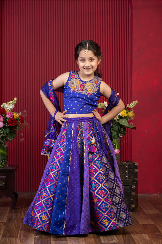 embroidered brocade lehenga set for girls with net dupatta and potli bag by Kirti Agarwal