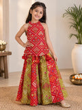 Vibrant Red and green silk two-piece set featuring a printed halter top with playful tassels and a flowy palazzo