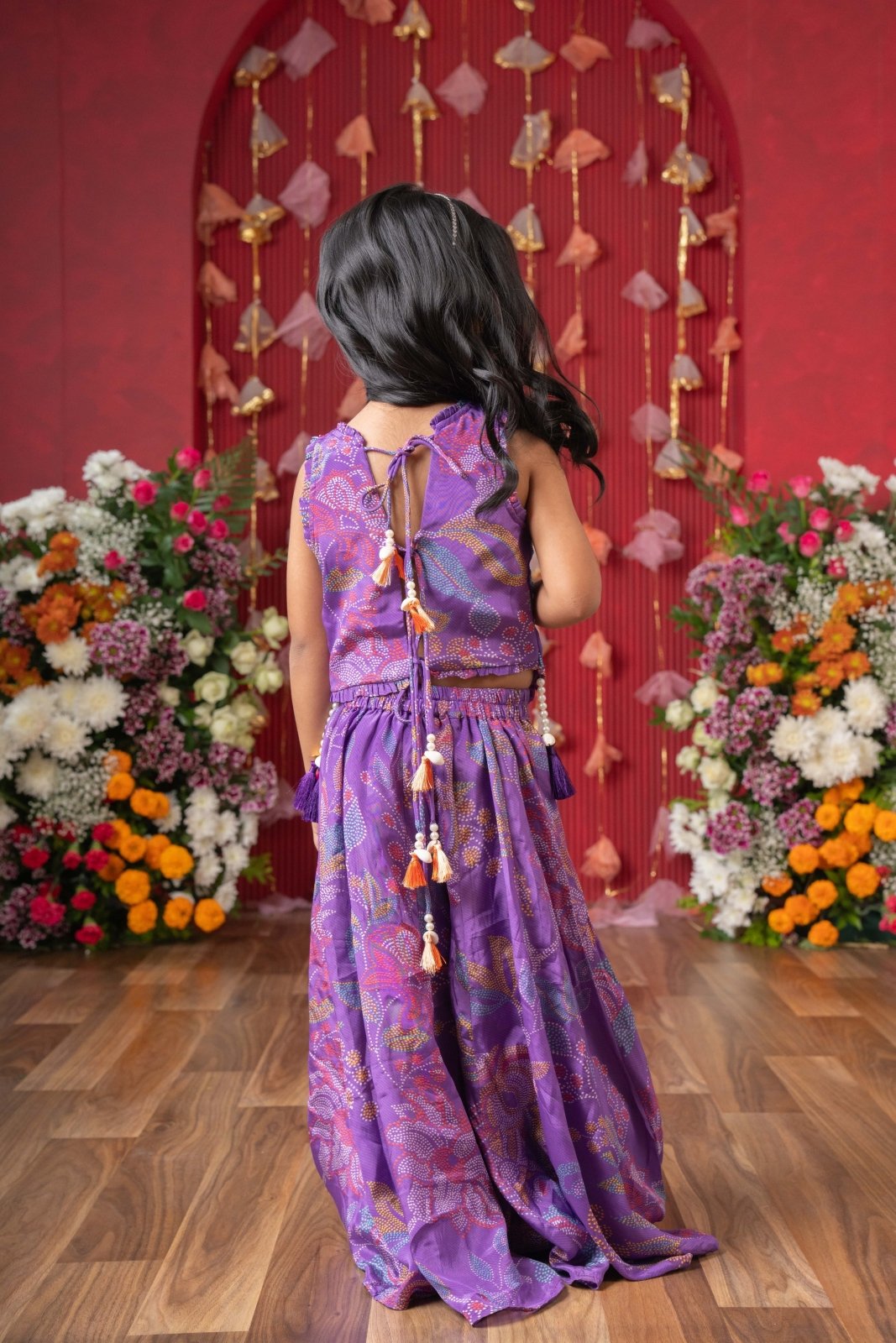 Add a pop of color to your celebrations with this vibrant purple printed top and flared palazzo set - Kirti Agarwal