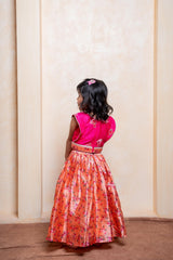 Add festive charm with this vibrant pink blouse and floral peach lehenga set for girls - Kirti Agarwal