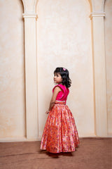 Add festive charm with this vibrant pink blouse and floral peach lehenga set for girls - Kirti Agarwal