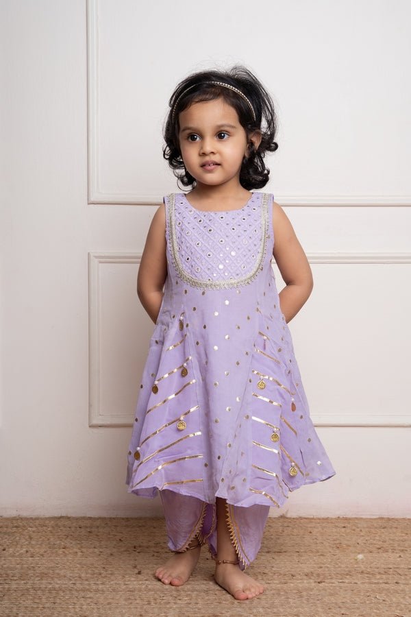 Adorable Lavender kurta with intricate mirror work and gold detailing, paired with a matching salwar for a charming festive look - Kirti Agarwal