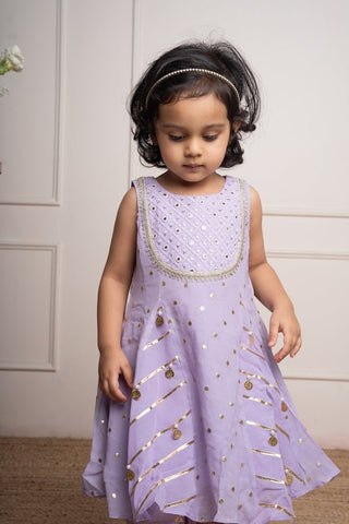 Adorable Lavender kurta with intricate mirror work and gold detailing, paired with a matching salwar for a charming festive look - Kirti Agarwal