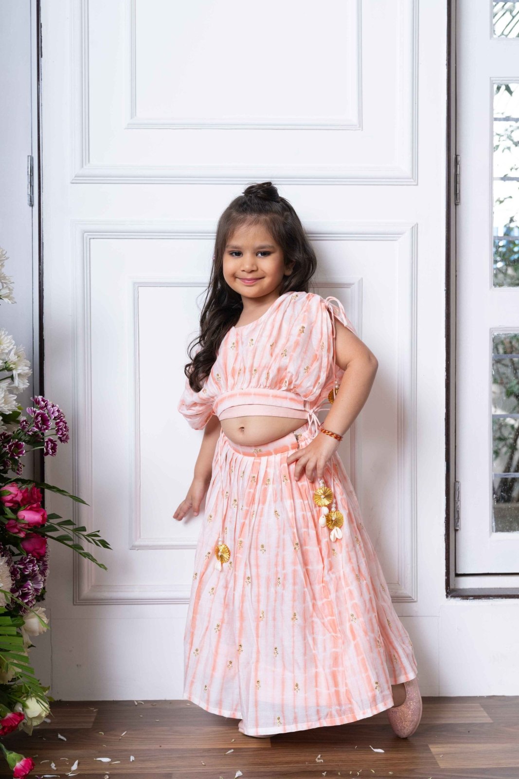 Blush Pink Lehenga Choli with Golden Embroidery and Floral Tassels for Kids - Kirti Agarwal