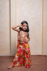 Brighten every festive moment with this embroidered Crepe Chinnon top and floral brocade palazzo set — perfect for your little fashionista - Kirti Agarwal