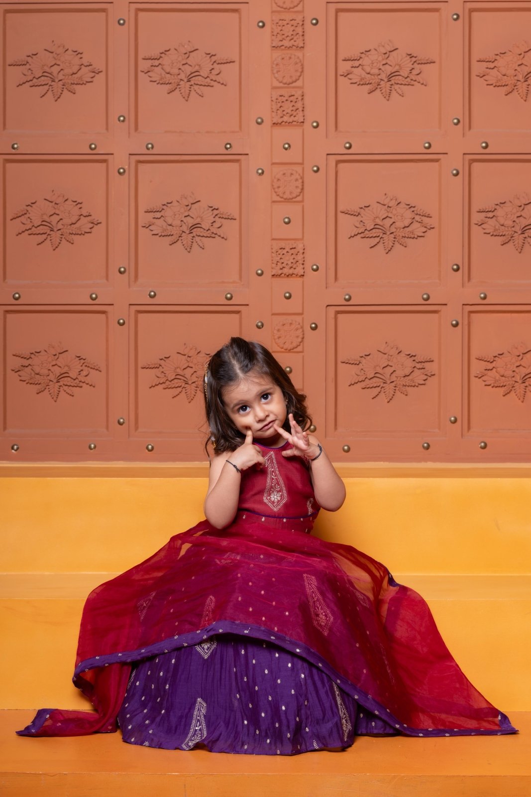 Bring festive elegance to her look with this maroon crop top and purple lehenga set for girls. - Kirti Agarwal