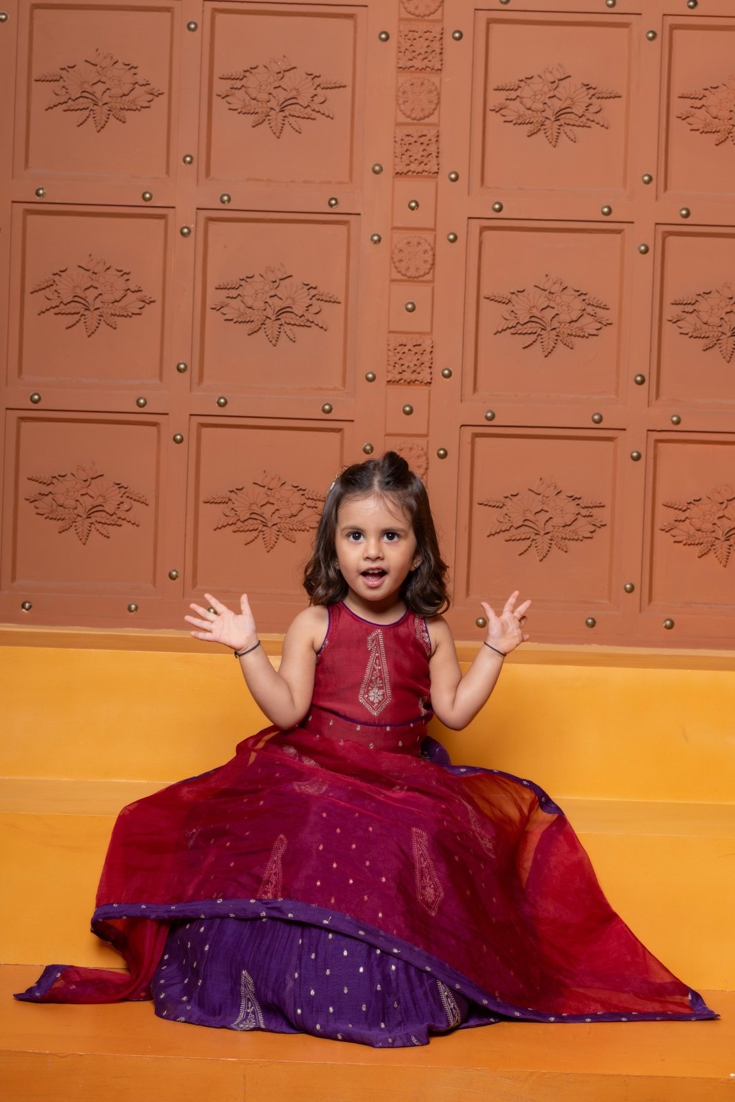 Bring festive elegance to her look with this maroon crop top and purple lehenga set for girls. - Kirti Agarwal