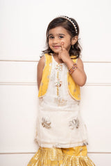 Charming ivory and yellow sharara set with delicate silver floral embroidery and playful appliqués - Kirti Agarwal