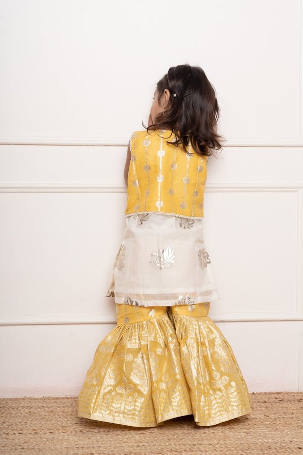 Charming ivory and yellow sharara set with delicate silver floral embroidery and playful appliqués - Kirti Agarwal