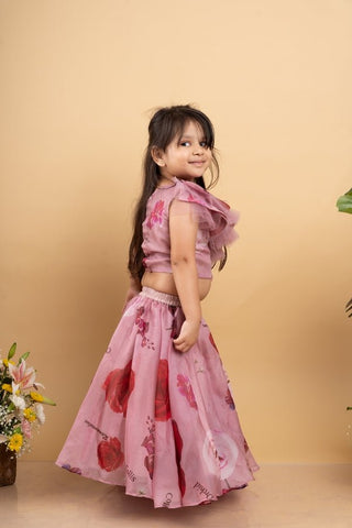 Charming off - shoulder pink ruffle top paired with a flowy floral lehenga for a delightful festive look - Kirti Agarwal