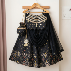 Elegant black Silk Lehenga set with rich Brocade Zari detailing, embellished crop top, dupatta and matching potli