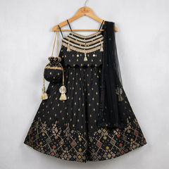 Elegant black Silk Lehenga set with rich Brocade Zari detailing, embellished crop top, dupatta and matching potli