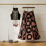 Black Embroidered Crepe Lehenga Set with Statement Pearl Tassel Top.