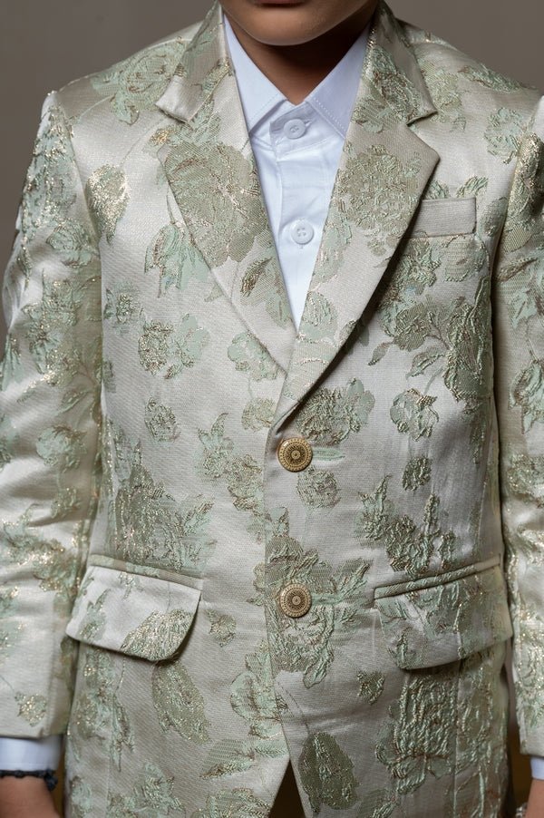 Elegant cream blazer with intricate green floral embroidery, paired with matching trousers and a crisp white shirt for a refined formal look - Kirti Agarwal