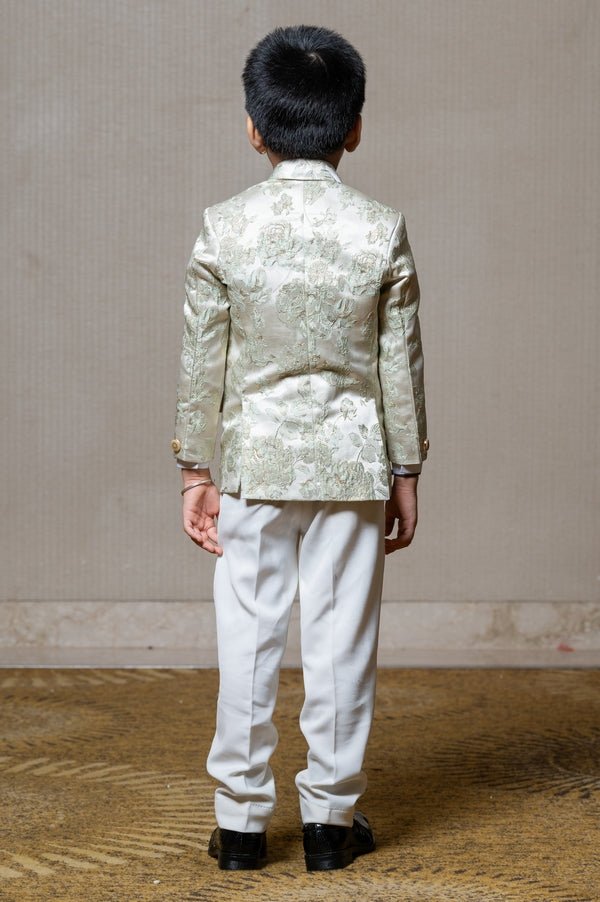 Elegant cream blazer with intricate green floral embroidery, paired with matching trousers and a crisp white shirt for a refined formal look - Kirti Agarwal