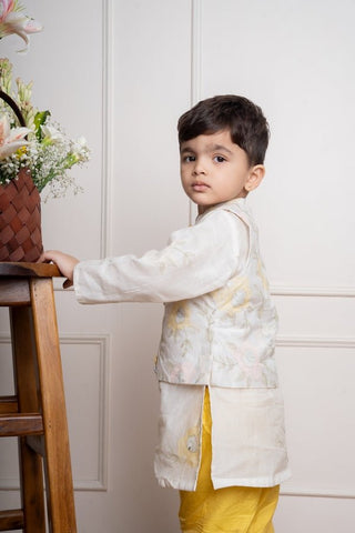 Elegant ivory kurta with matching embroidered jacket and vibrant yellow churidar pants, a stylish ensemble for festive occasions - Kirti Agarwal